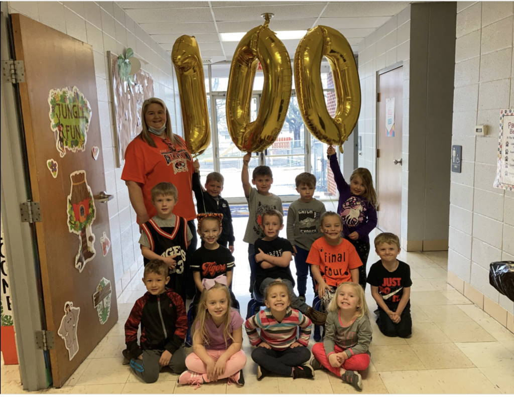 Students with a balloon 100